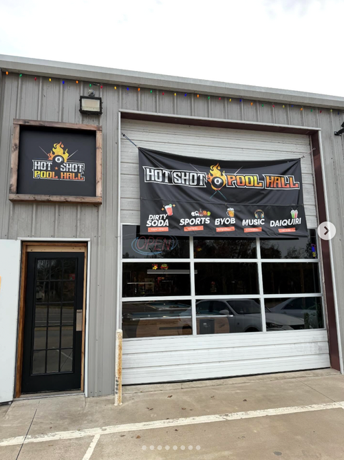 Front of a building with 'Hot Shot Pool Hall' sign and banner.